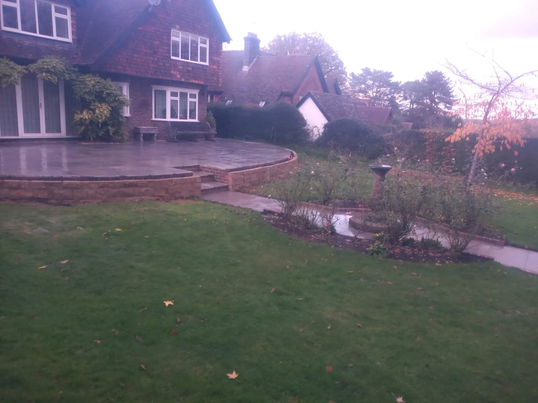Curved raised patio with stone wall - bricklayer in Bexhill, East Sussex